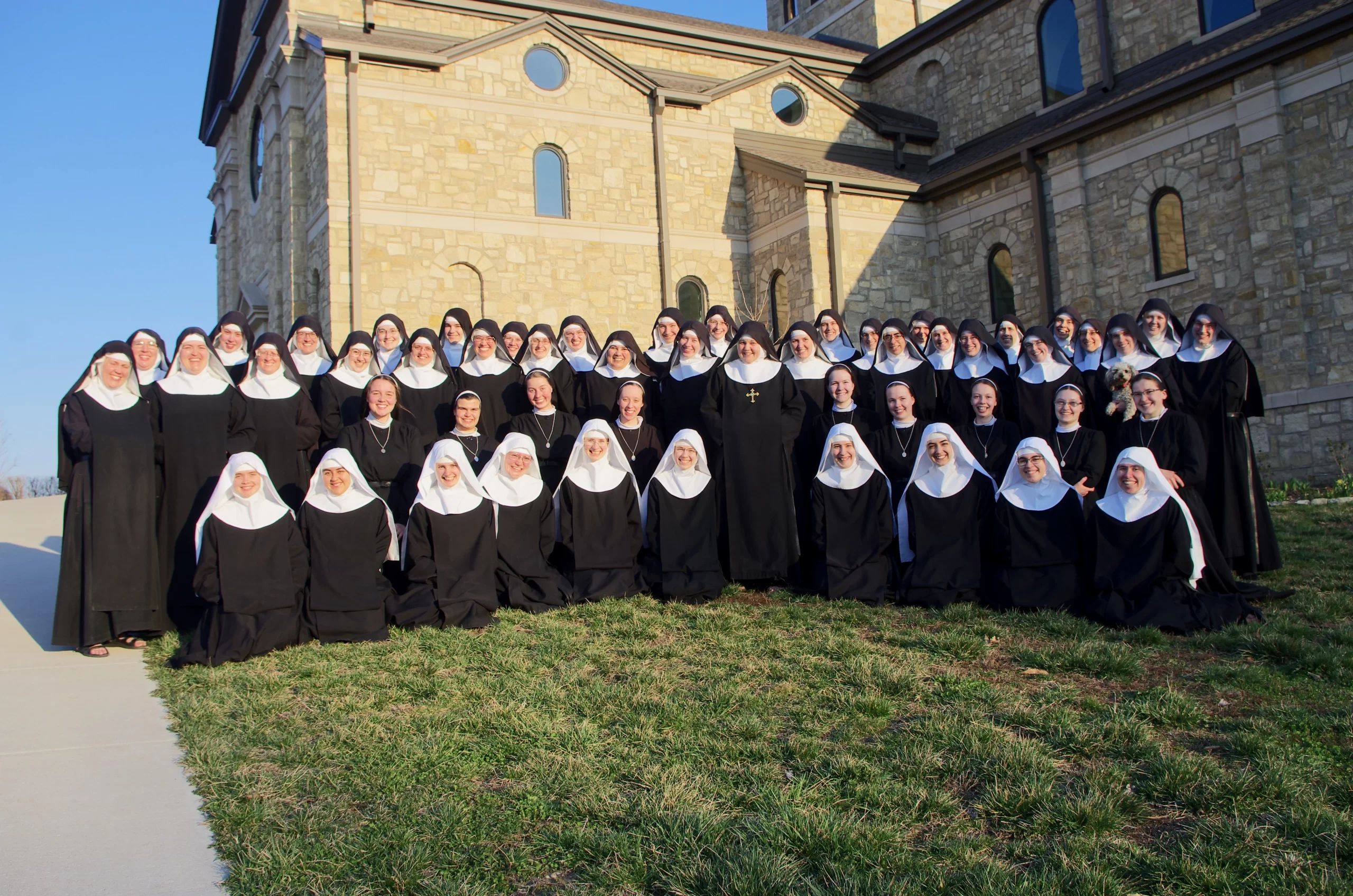 The community gathers before the English departure. Courtesy of Benedictines of Mary, Queen of Apostles