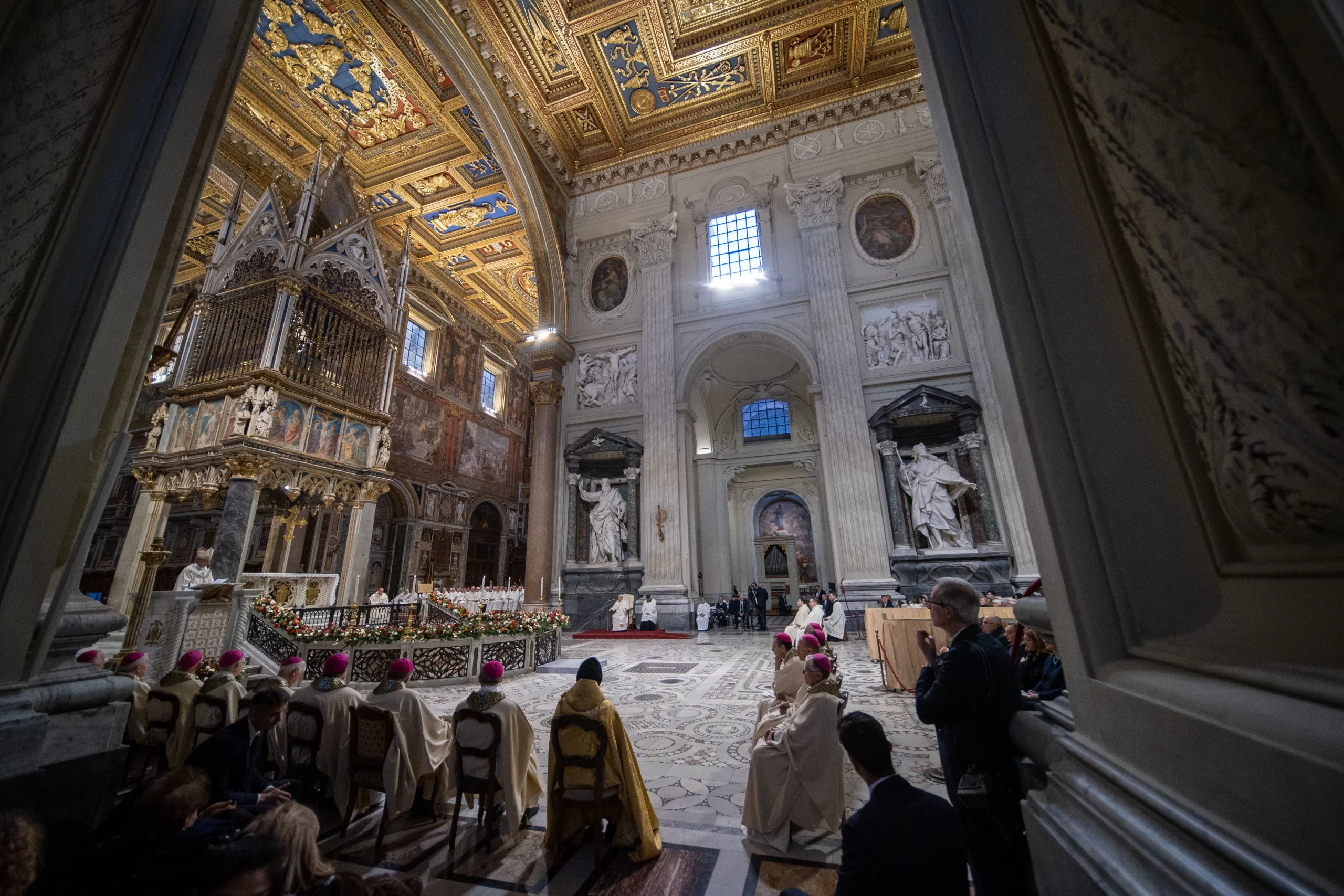 The interior of the Archbasilica of St. John Lateran during the episcopal ordination ceremony, with its ornate Renaissance ceiling and marble statuary providing a majestic setting for the sacred celebration. Credit: Daniel Ibáñez/CNA