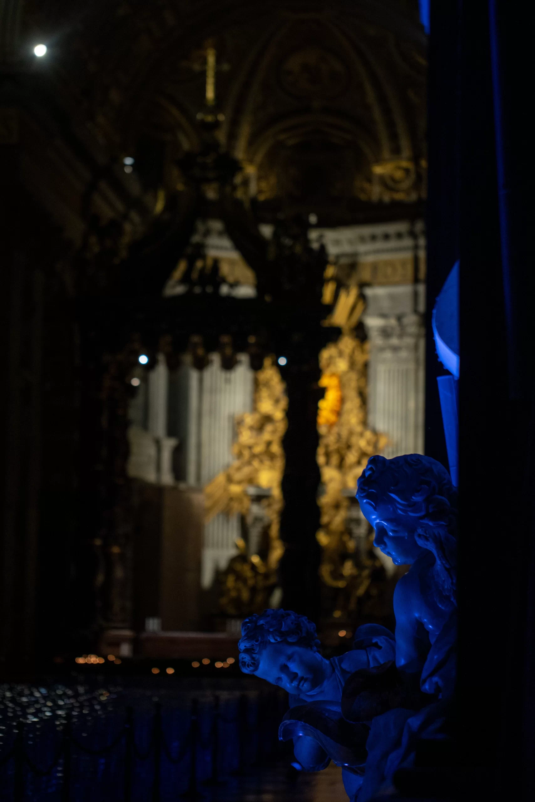 Angelic figures bathed in blue light inside St. Peter's Basilica during the 'White Night at St. Peter's' event, part of the Jubilee of Artists at the Vatican, Feb. 16, 2025. Credit: Daniel Ibáñez/CNA