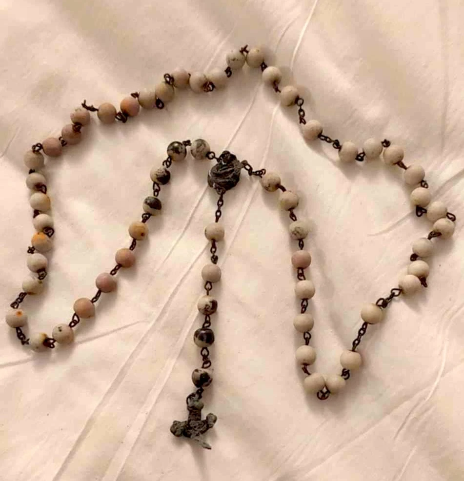 Monica Biboso's rosary, the only one of her belongings left intact after the home of Ester Rot, the elderly woman she cared for and where she also lived in Kibbutz Be'eri, was set on fire by Hamas fighters during the Oct. 7, 2023, attack. “All my things were reduced to ashes,” Biboso recounted, “but my rosary didn’t burn. My husband gave it to me and I used to pray with it every day before sleeping. I know I’m safe because of it.” Credit: Photo courtesy of Monica Biboso