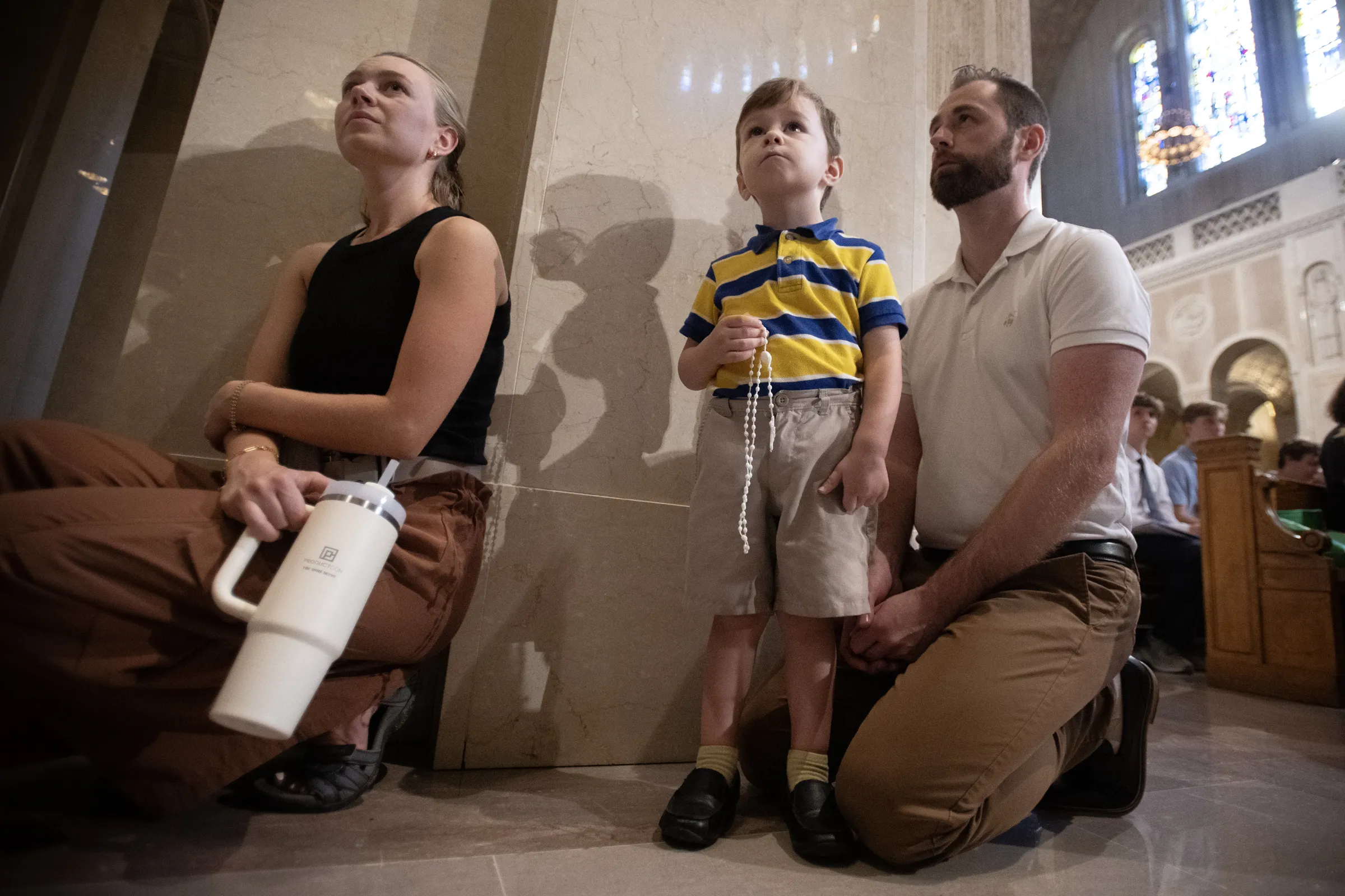 A family prays the rosary at the Dominican Rosary Pilgrimage at the National Shrine of the Immaculate Conception in Washington, D.C., on Sept. 28, 2024. Credit: Jeffrey Bruno