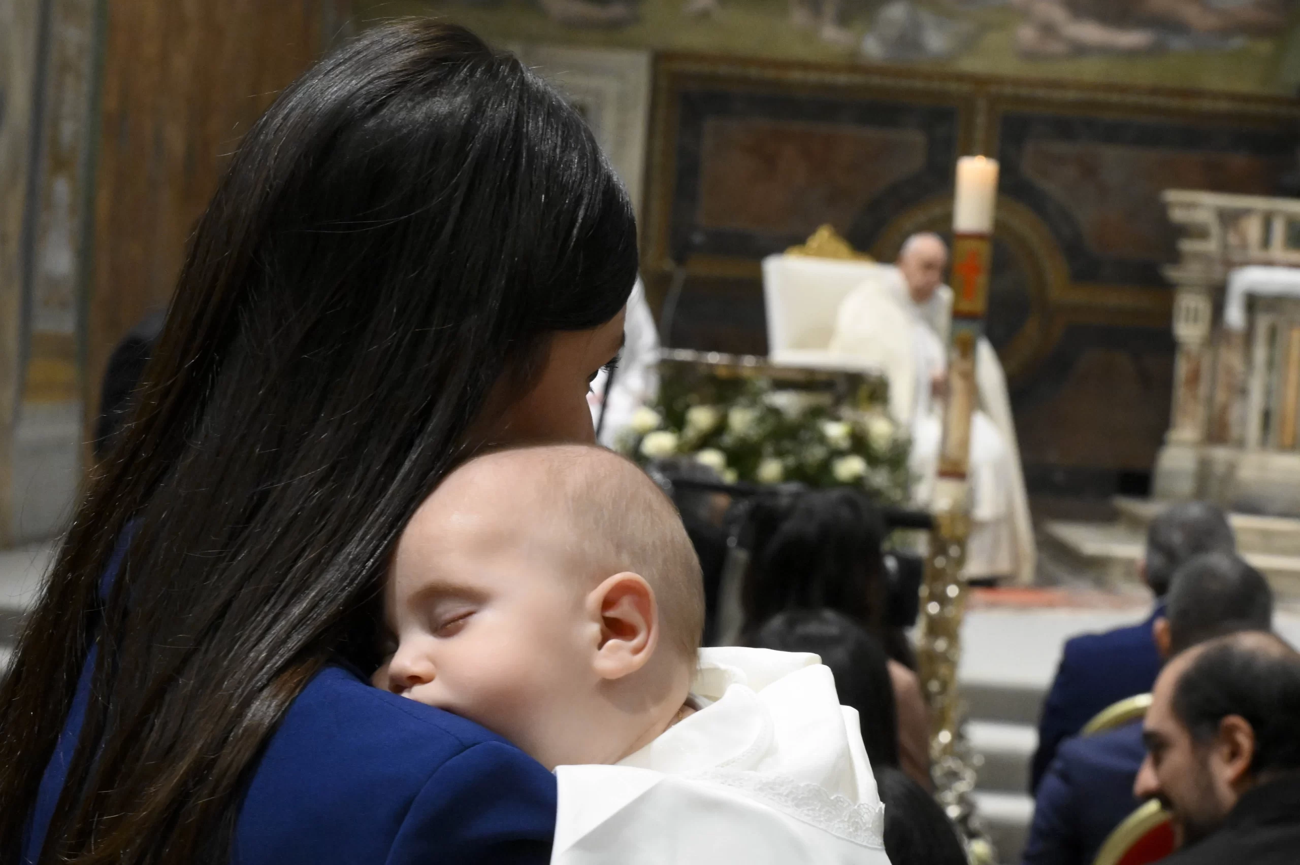 A baby sleeps at the feast of the Baptism of the Lord at the Sistine Chapel, Sunday, Jan. 12, 2025. Credit: Vatican Media