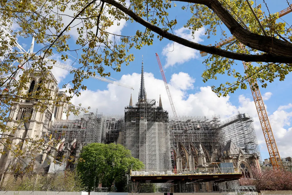 Notre-Dame de Paris Cathedral and its new spire are seen almost five years after a fire ravaged the emblematic monument on April 10, 2024, in Paris. On April 15, 2019, a fire broke out in the heart of Notre-Dame de Paris. For about 15 hours, firefighters fought against the flames that ravaged this historic monument in the French capital. Almost five years later, the last stages of securing continue. The securing of the building, between the stabilization of the structure, the replacement of stones, and the solidification of the vaults, will have cost 165 million euros (about $ 179 million). Credit: Chesnot/Getty Images