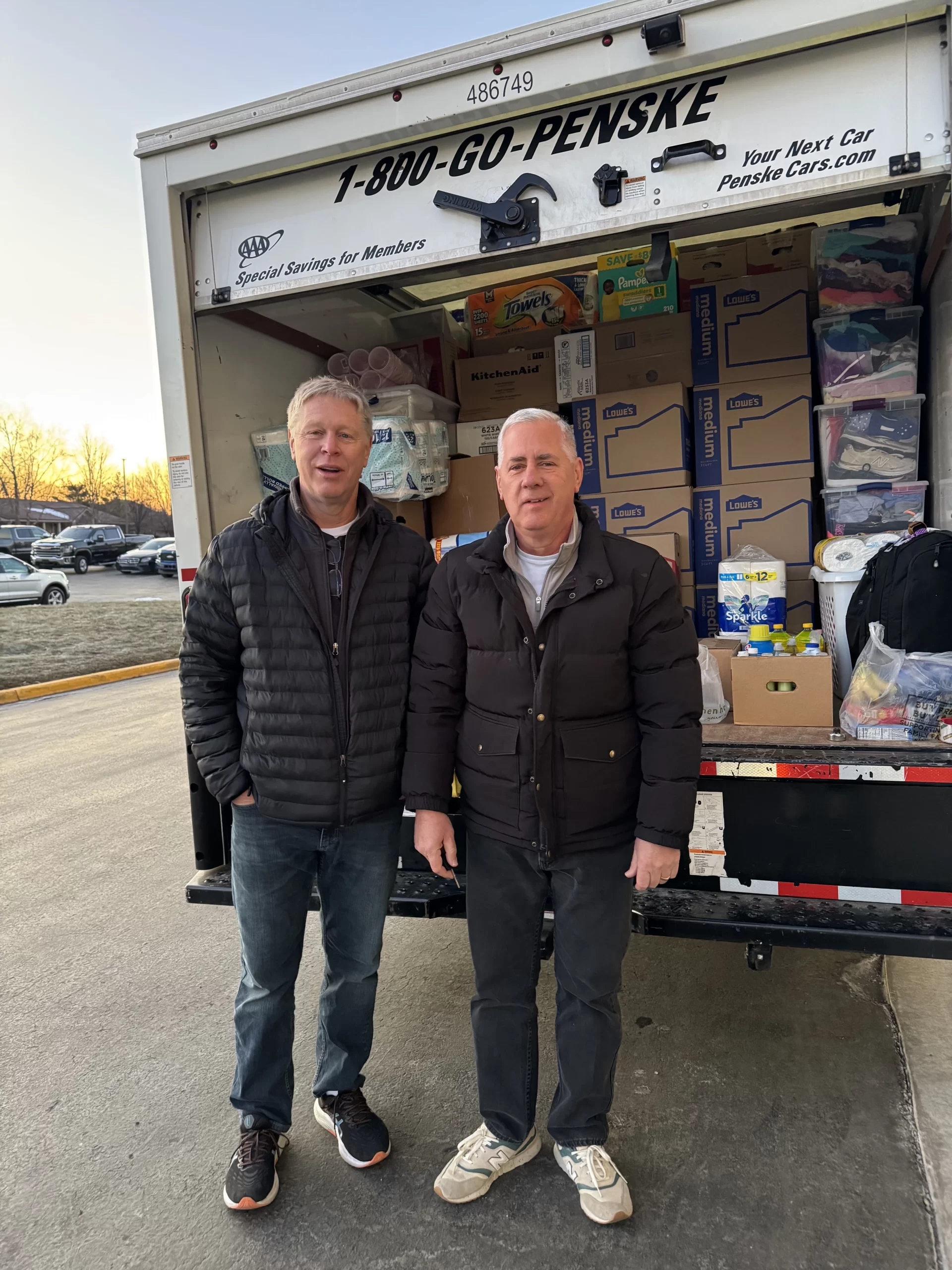 Deacon Greg Trum (right) and Mike Klover get ready to head to Los Angeles with a truckload of supplies. Credit: Photo courtesy of Greg Trum