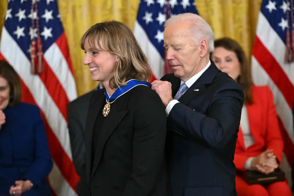 President Joe Biden presents the Presidential Medal of Freedom to U.S. swimmer Katie Ledecky in the East Room of the White House in Washington, D.C., on May 3, 2024. Credit: ANDREW CABALLERO-REYNOLDS/AFP via Getty Images