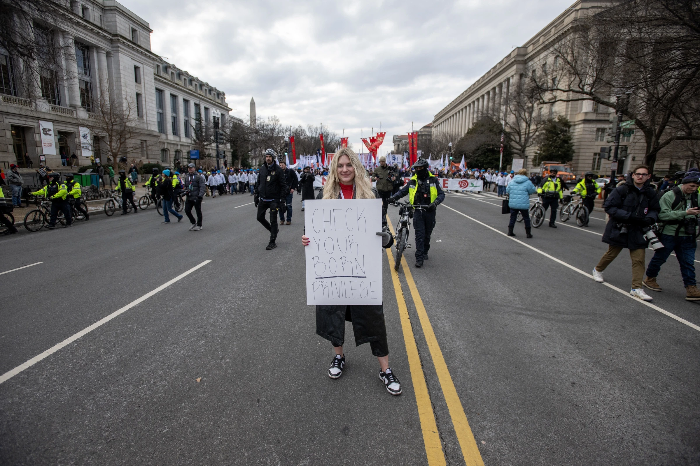 Pro-life activist Anna Lulis holds the sign "Check your born privilege.". Credit: Jeffrey Bruno