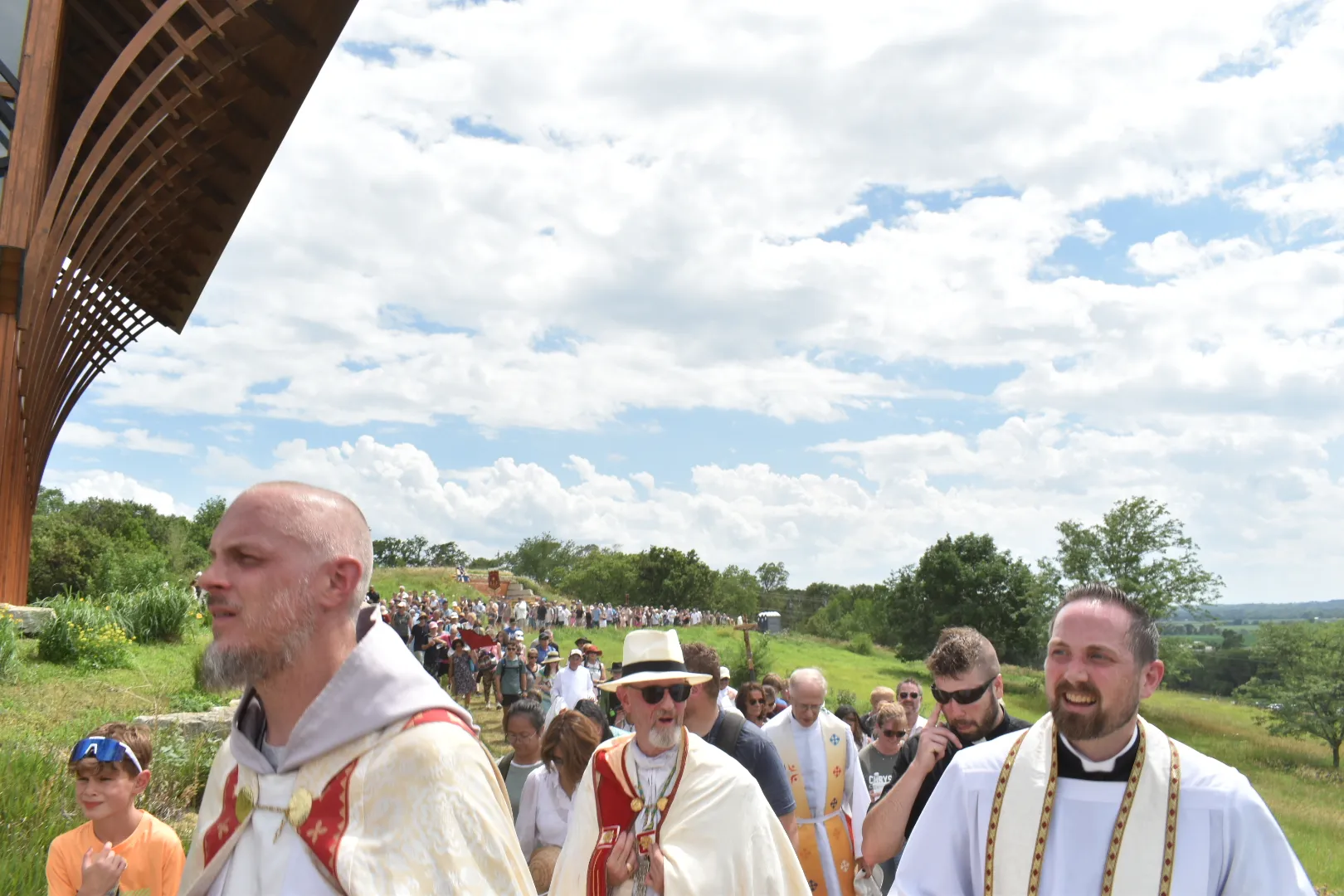The Eucharistic procession reaches the Holy Family Shrine, led by Bishop James Conley (center), as participants follow along the pathway around the shrine on June 21, 2024. Credit: Kate Quiñones/CNA