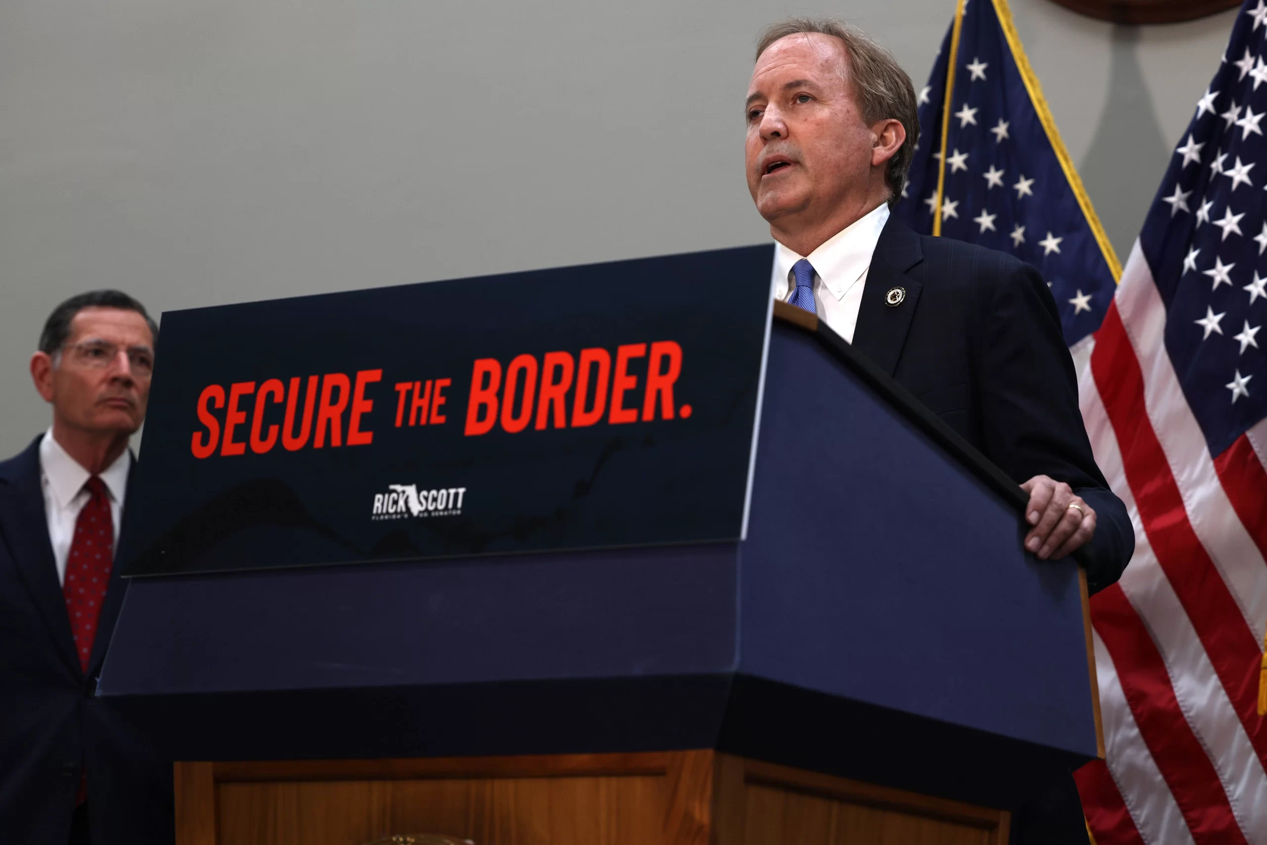 Texas Attorney General Ken Paxton discussing the border crisis in Washington, D.C. on May 12, 2021. Credit: Anna Moneymaker/Getty Images