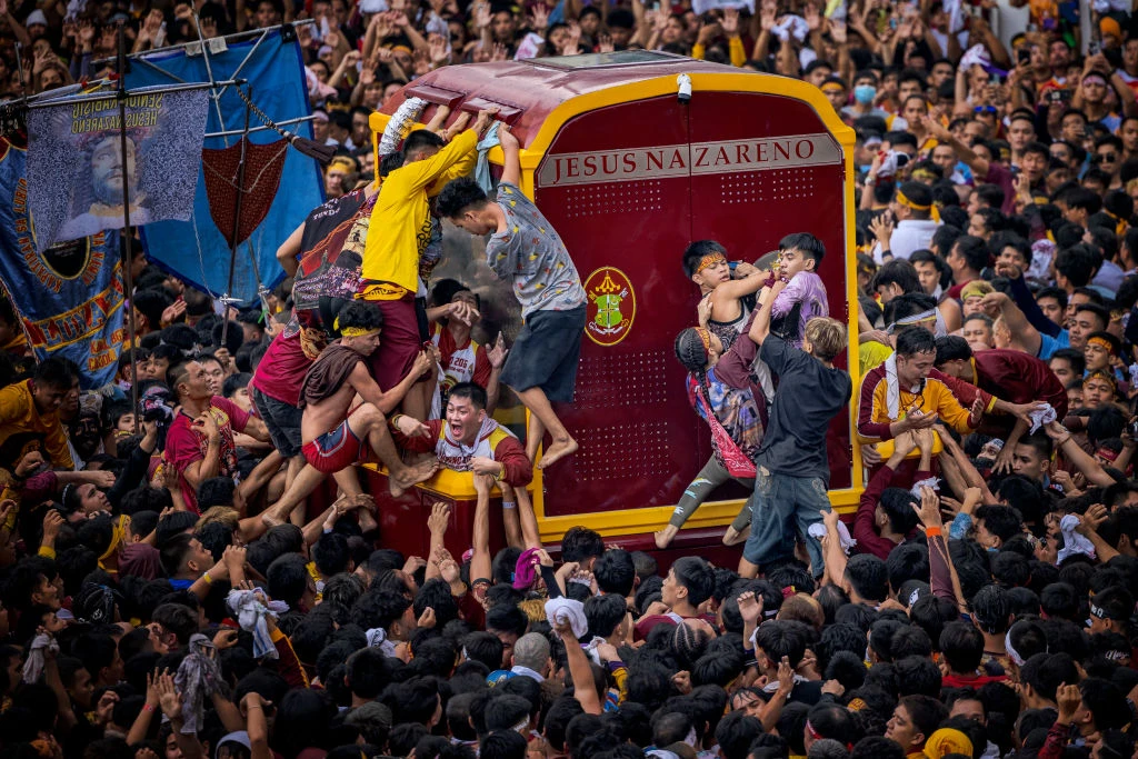 Filipino Catholic devotees jostle one another to touch the Black Nazarene during its annual procession on Jan. 9, 2025, in Manila, Philippines. Credit: Ezra Acayan/Getty Images