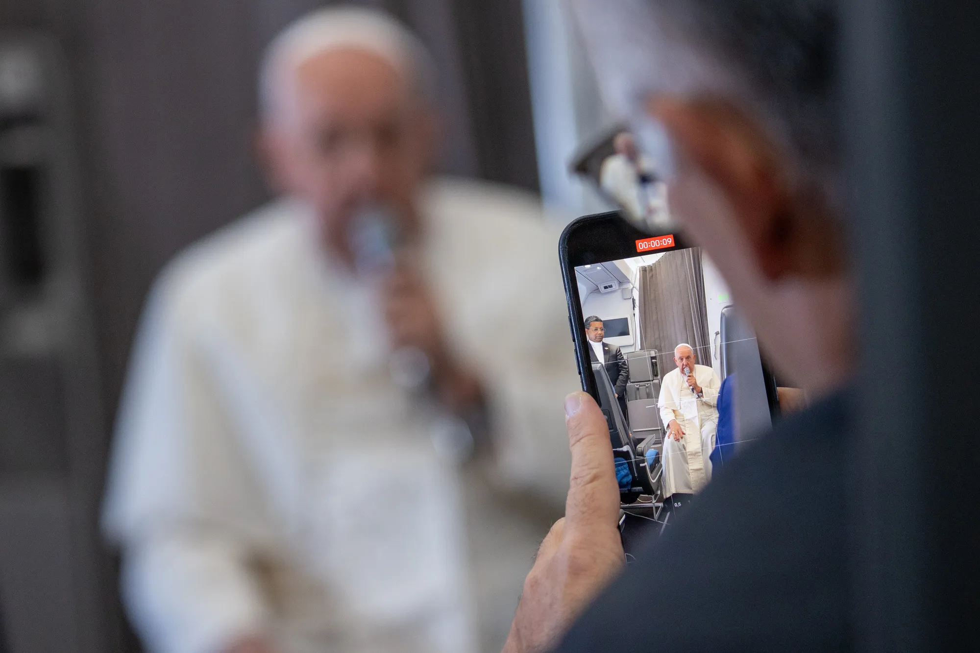 Pope Francis speaks to journalists aboard the papal plane during an in-flight press conference on Friday, Sept. 13, 2024, on his return from his nearly two-week tour of Southeast Asia. Credit: Daniel Ibañez/CNA