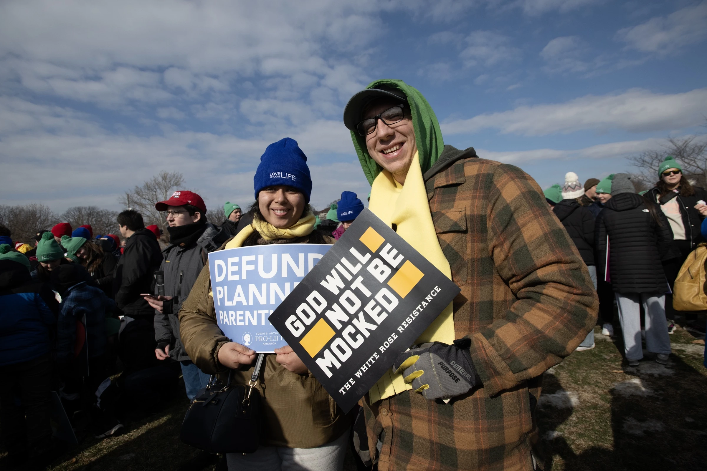 "God will not be mocked" and "Defund Planned Parenthood" signs were held by these pro-life marchers. Credit: Jeffrey Bruno