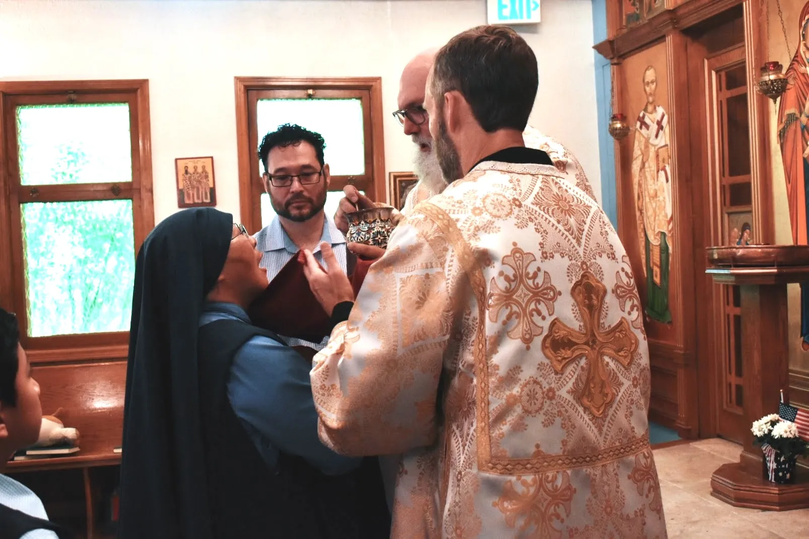 Sister Mary Rose Chinn receives the Eucharist during a Byzantine Catholic Divine Liturgy on June 8, 2024. The Eucharist is given via “intinction,” where the small cubes of consecrated, leaven bread are placed in the chalice and given on a spoon. Credit: Kate Quiñones/CNA