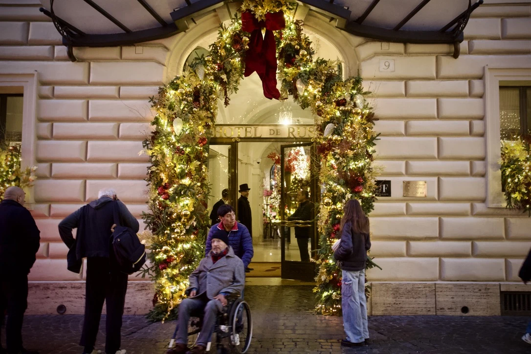 A building is decorated festively for Christmas in Rome, Italy, Dec. 17, 2024. Credit: Courtney Mares/CNA