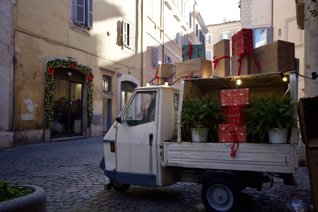 A truck delivers Christmas presents and plants in Rome, Italy, Tuesday, Dec. 17, 2024. Credit: Courtney Mares/CNA