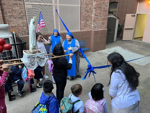 Saint John Paul the Great Academy’s first students process in honor of Our Lady. Credit: Saint John Paul the Great Academy