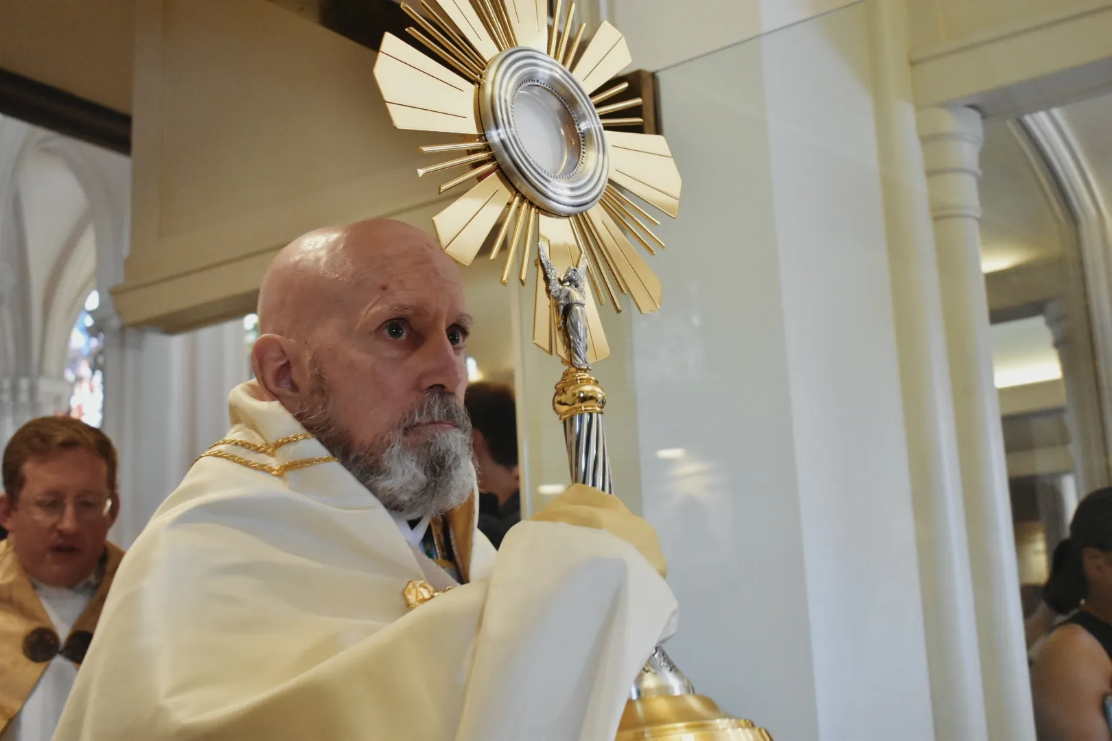 Archbishop Samuel Aquila carries the Eucharist out of the Cathedral Basilica of the Immaculate Conception in Denver on June 9, 2024. Credit: Kate Quiñones/CNA