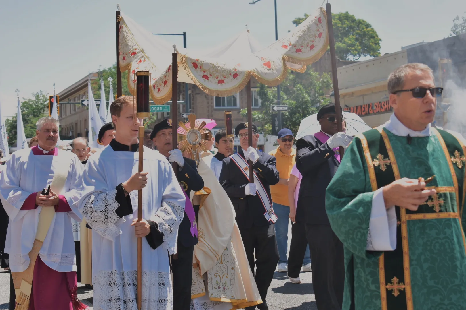 Archbishop Samuel Aquila carries the monstrance down Colfax Avenue in downtown Denver on June 9, 2024. Credit: Kate Quiñones/CNA