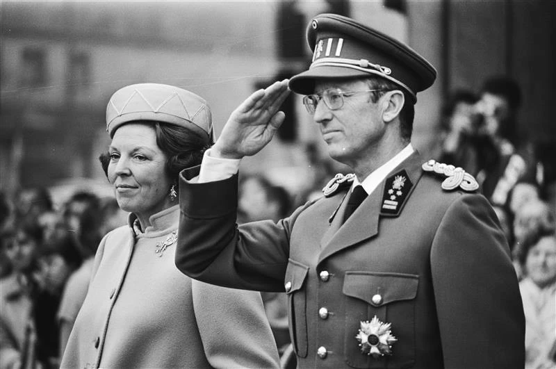 King Baudouin salutes during the playing of the Belgian national anthem, March 31, 1981. Credit: Marcel Antonisse/Anefo, CC0, via Wikimedia Commons