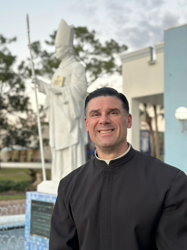 Father Rafael Capó is seen here on the campus at St. Thomas University in Miami. Credit: Antonio Dejesus