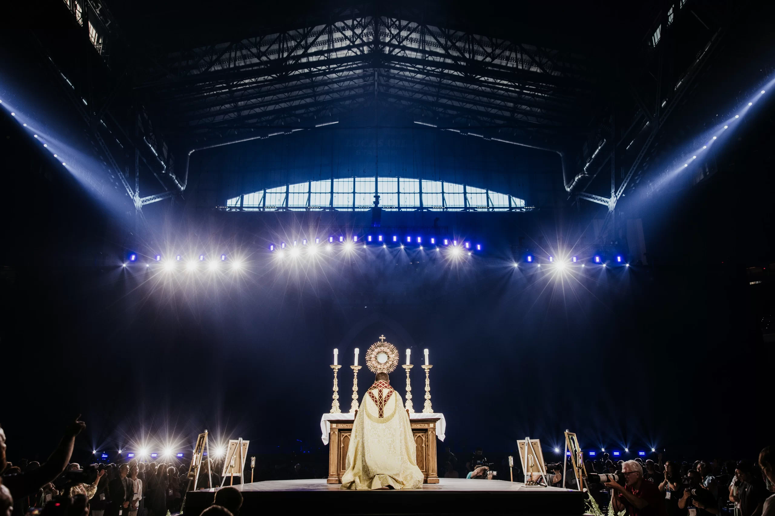 Bishop Andrew Cozzens of Crookston, Minnesota, who spearheaded the U.S. bishops’ initiative of Eucharistic Revival, adores Christ in the Eucharist with tens of thousands of people in Lucas Oil Stadium. Credit: Casey Johnson in partnership with the National Eucharistic Congress