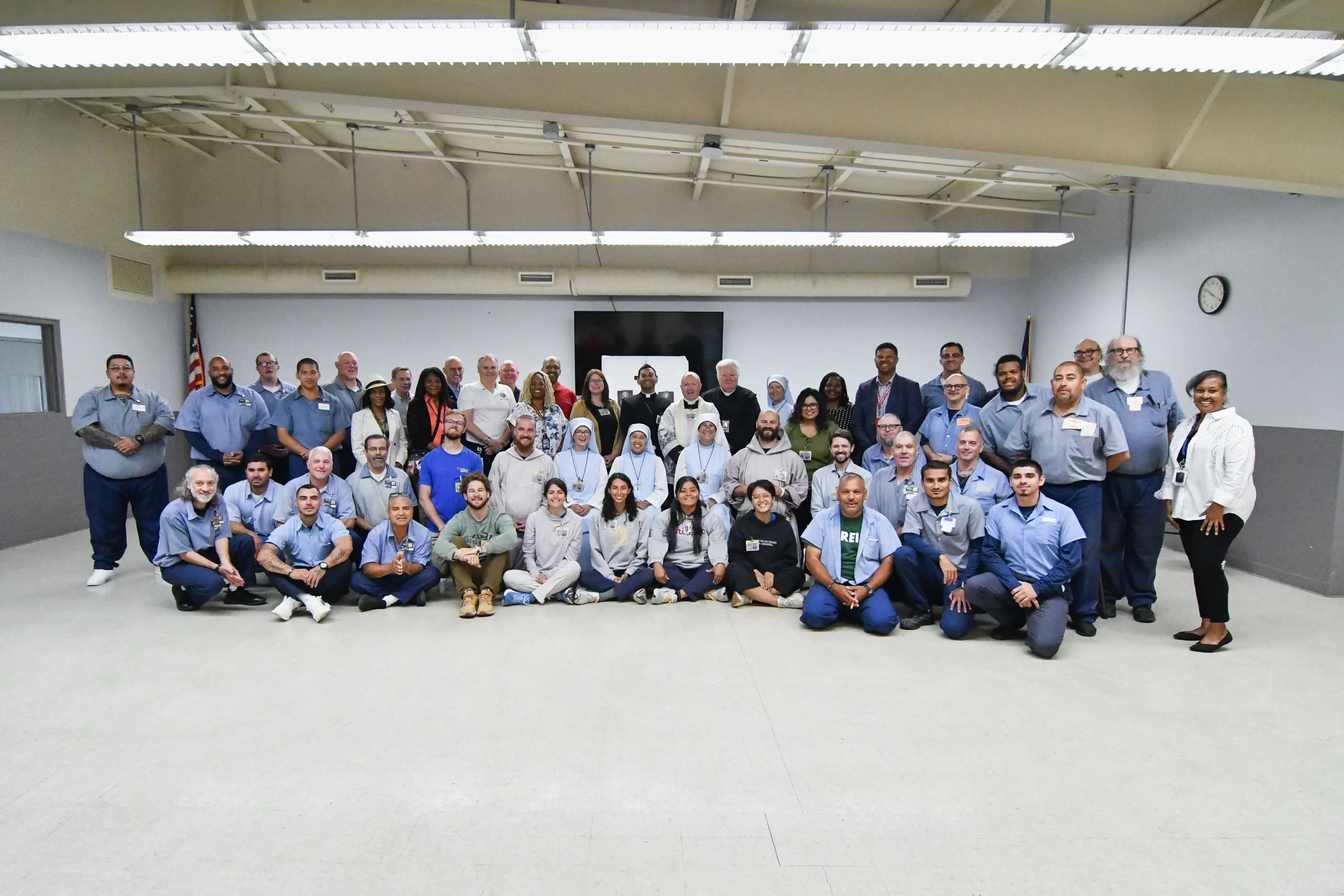 The group gathers for a photo near the end of the National Eucharistic Pilgrimage visit to Pickaway Correctional Institution near Columbus, Ohio, on June 28, 2024. Credit: Catholic Times/Ken Snow