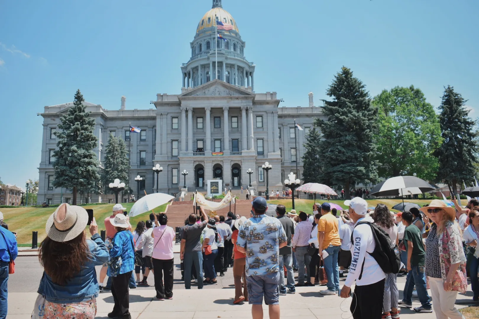 Archbishop Samuel Aquila blesses the state capitol of Colorado as participants watch and pray on June 9, 2024. Credit: Kate Quiñones/CNA