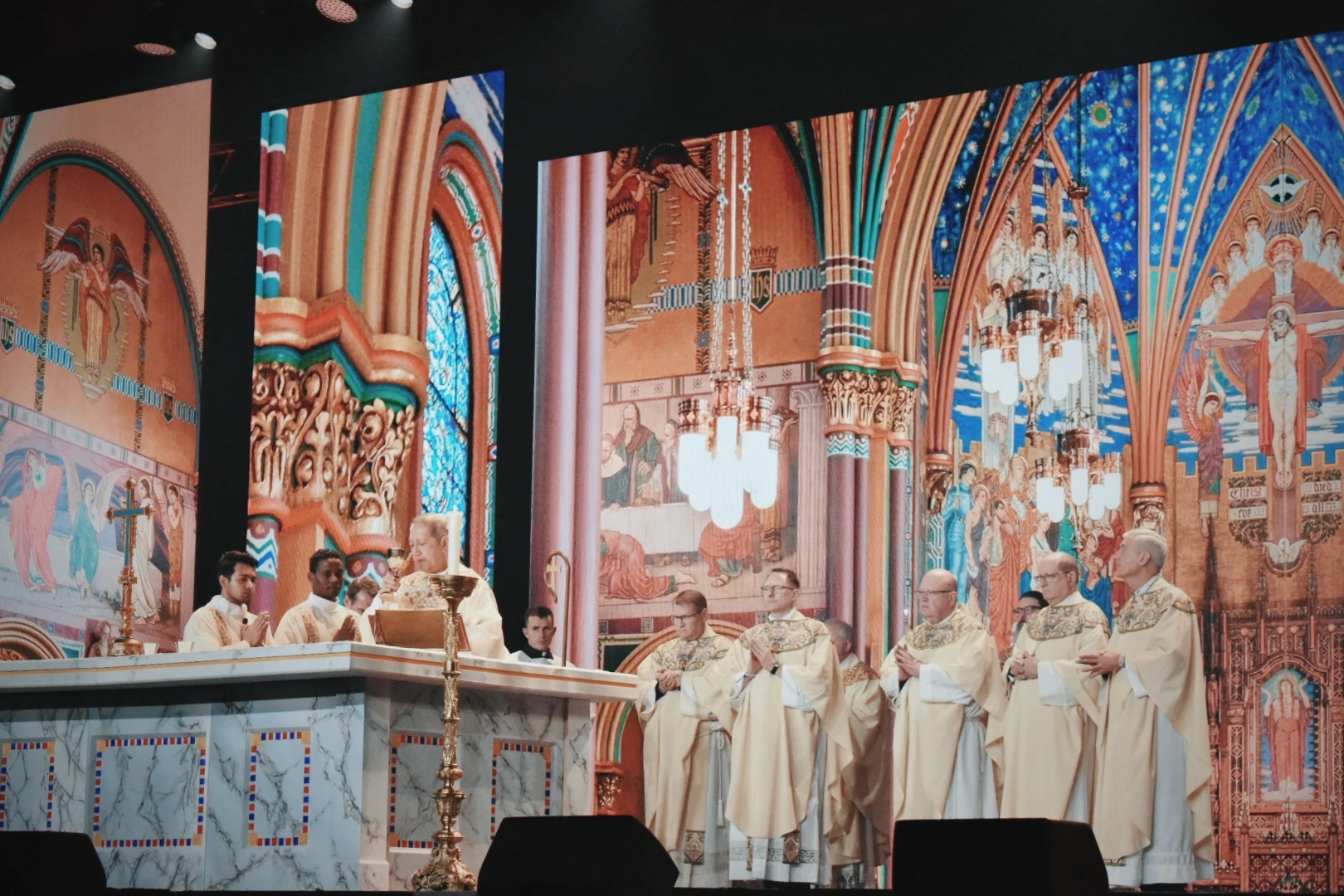 The exuberant crowd of mostly young adults grew quiet when the opening Mass began, which took place the night of New Year’s Day on the feast of Mary, Mother of God, at SEEK25 in Salt Lake City. Credit: Kate Quinones