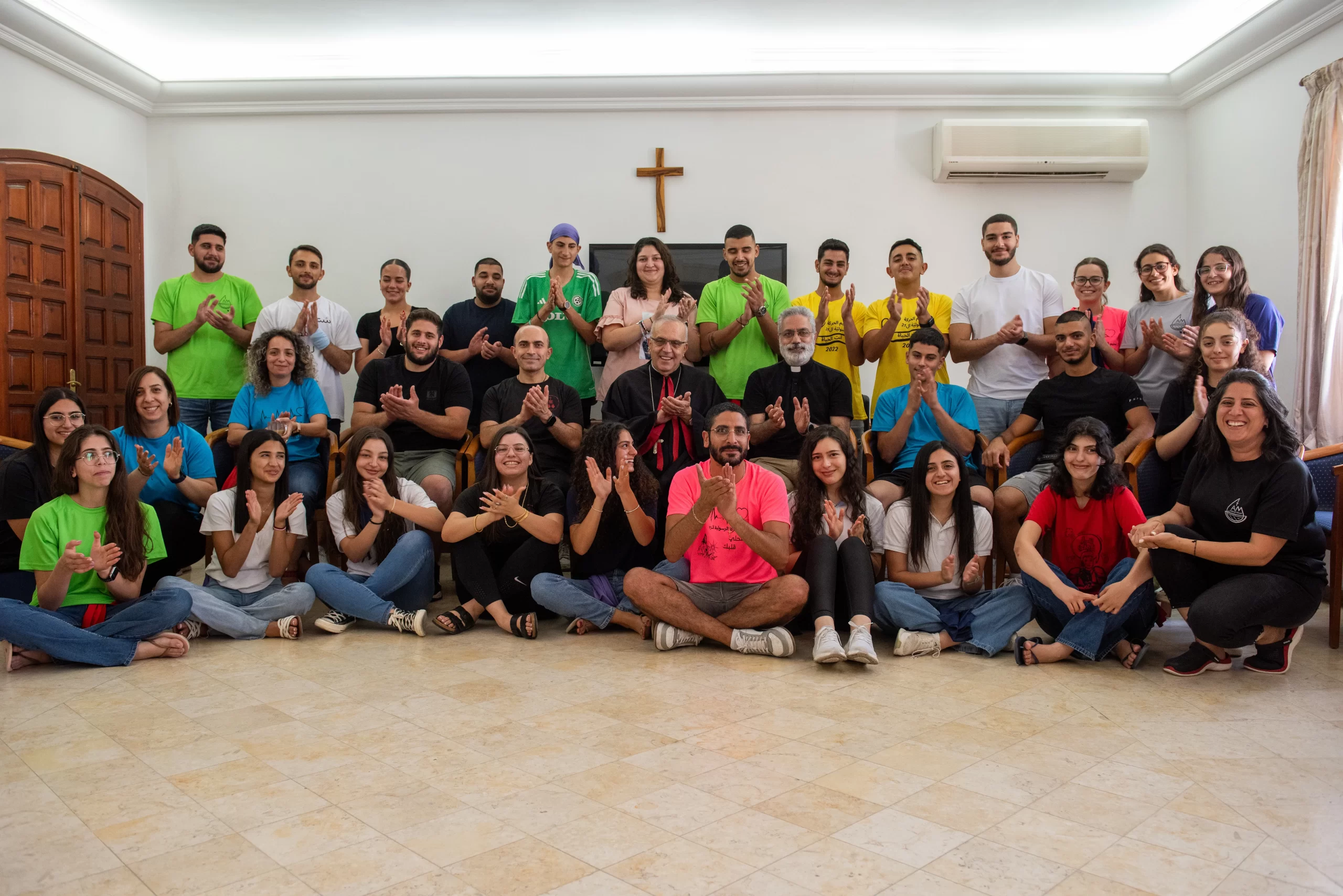 A group of young people from the Apostolic Movement of Jish, an Israeli Arab village located at the foot of Mount Meron, a few kilometers from the Lebanese border. In the center is Monseigneur Moussa El-Hage, Maronite archbishop of Haifa and the Holy Land. To his right is Father Sandy Habib, the Maronite parish priest of Jish. July 2024. Credit: Marinella Bandini