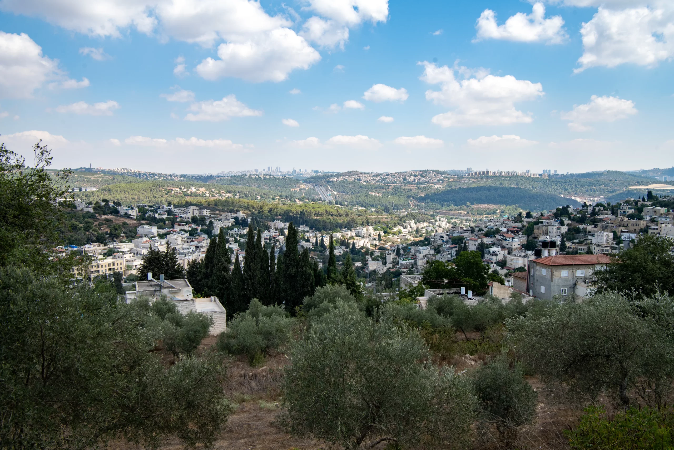 A view from the hill of Kiryat Yearim, where the Church of Our Lady of the Ark of the Covenant stands. At the foot of the hill lies the Muslim village of Abu Gosh, with Jerusalem visible in the background, a little more than nine miles away. The place, mentioned in the Bible as “Kiriath-Jearim,” held an important role in the history of the Jewish people, as it was here that the Ark of the Covenant rested for about 20 years until King David brought it to Jerusalem. Credit: Marinella Bandini