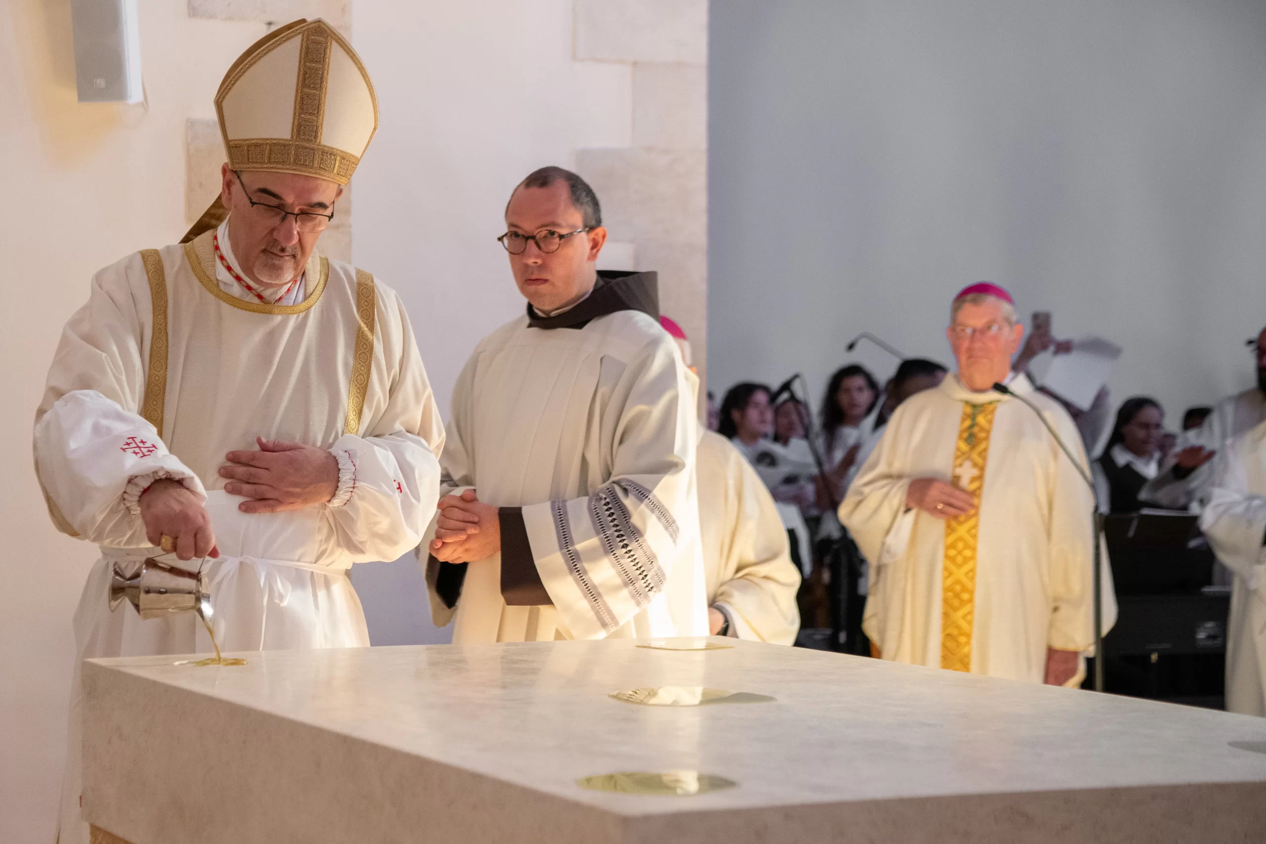 Cardinal Pierbattista Pizzaballa, the Latin patriarch of Jerusalem, pours the chrism oil on the new altar of the Church of Our Lady of the Ark of the Covenant in Kiryat Yearim. On Aug. 31, 2024, he presided over the solemn Mass with the rite of dedication of the altar, marking the reopening of the church after four years of restoration and maintenance work. Credit: Marinella Bandini