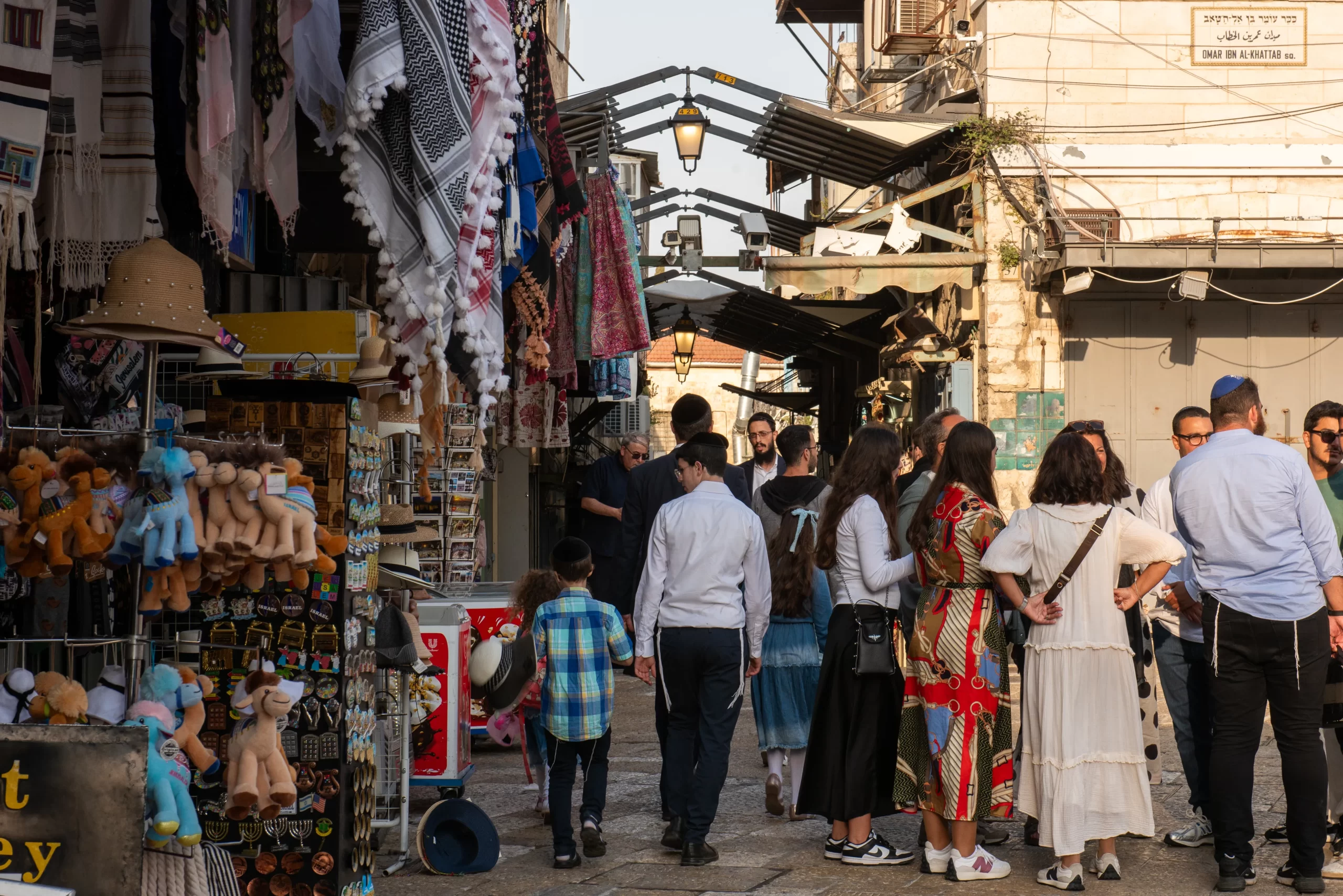 A religious Jewish family/group at the entrance of the Christian souk, from Jaffa Gate, in April 2024. Many Jews use this street to go to the Western Wall. Credit: Marinella Bandini