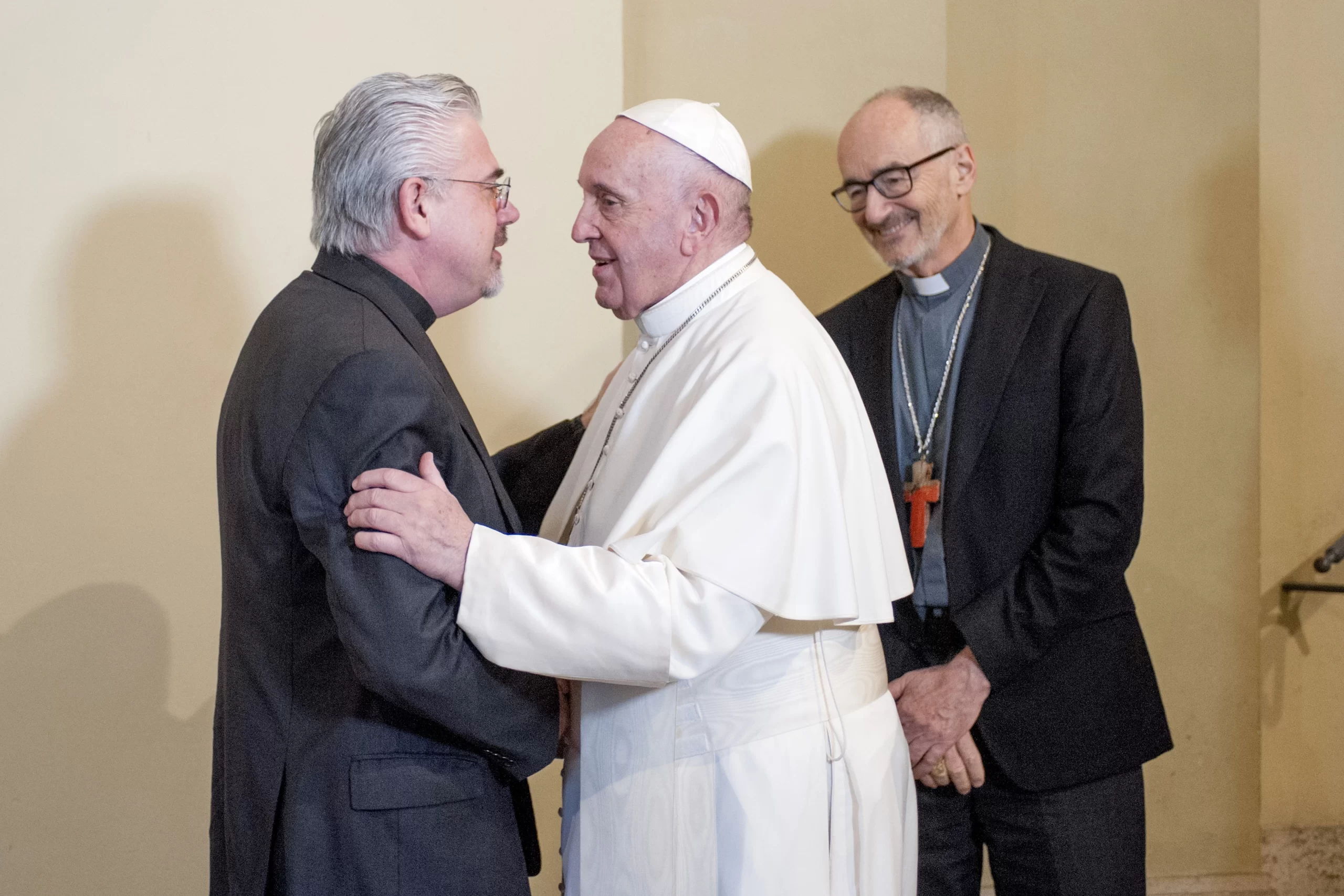 Pope Francis greets Father Fabio Baggio during a meeting with refugees people from Lesbo at the Apostolic Palace on Dec. 19, 2019. Credit: Vatican Pool/Getty Images