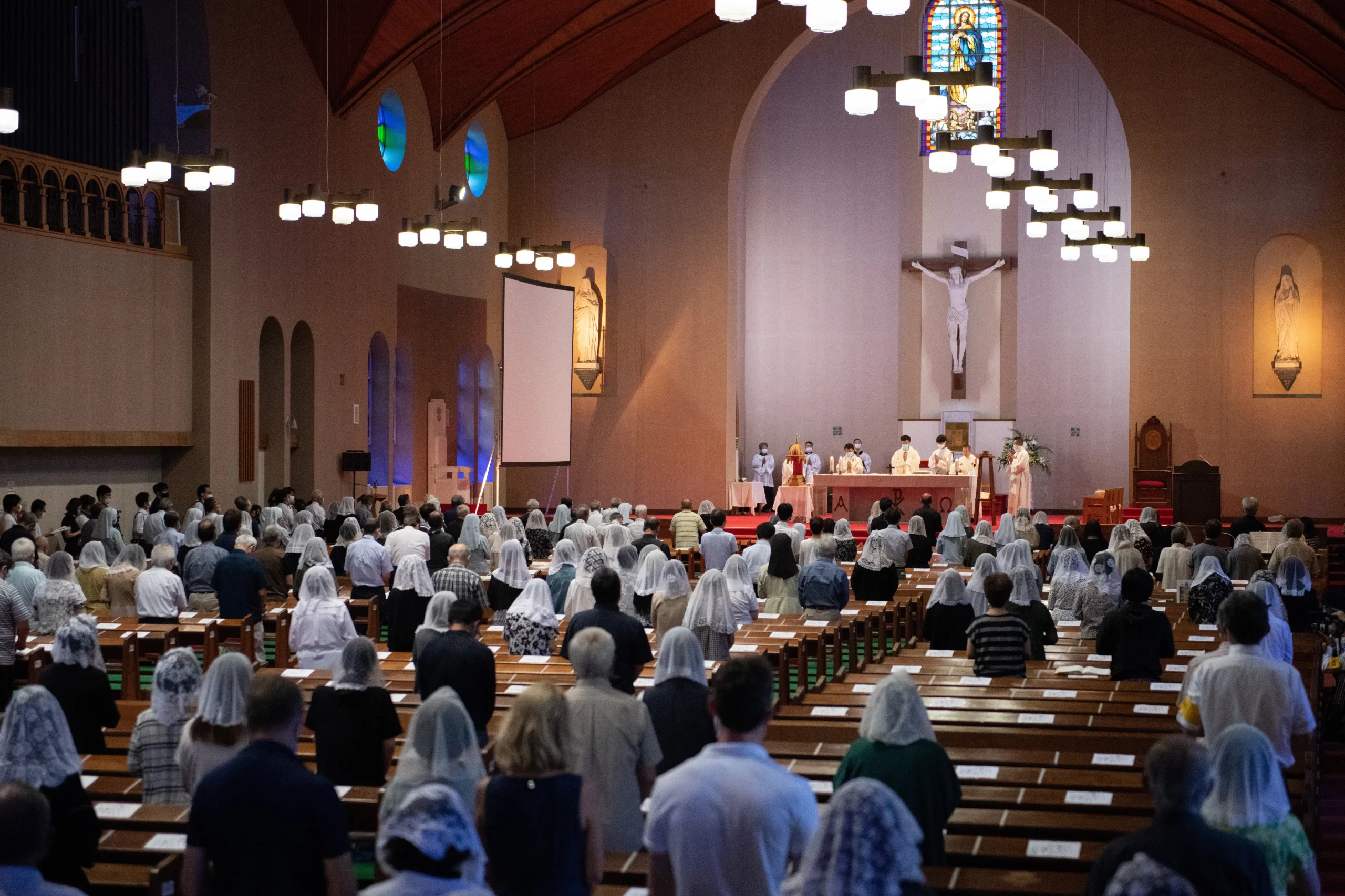 Worshippers attend a Sunday Mass at Urakami Cathedral dedicated to the victims of the atomic bomb on the 75th anniversary of the Nagasaki atomic bombing, on August 9, 2020 in Nagasaki, Japan. Credit: Carl Court/Getty Images