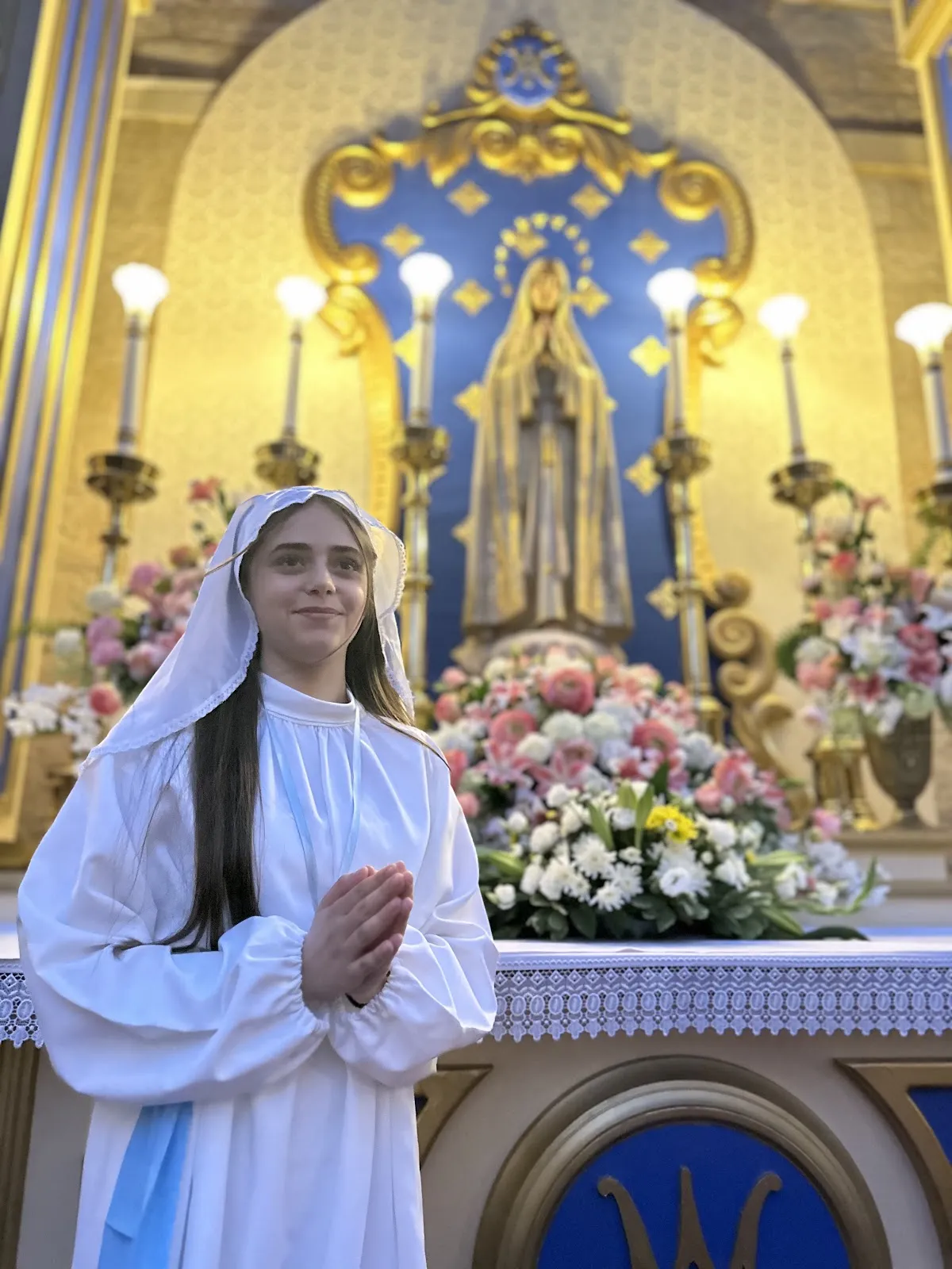 Among the girls carrying the statue was Selene Nicodemus, 16, who expressed her gratitude for this opportunity, saying: "It is not easy to carry the statue of the Virgin and march with it for this long distance. Today, I remembered the difficult journey that the Virgin Mary lived, and I kept telling myself, 'The Virgin always carries my worries and problems, and today I carry her memory and walk with it through the old alleys of Jerusalem.' It is a beautiful feeling, and I thank the Virgin for this opportunity." Credit: Rafi Ghattas