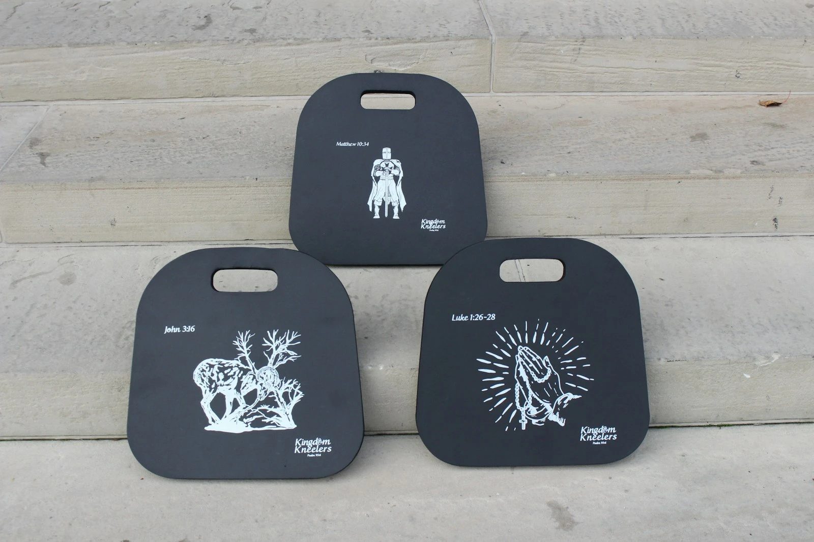 Kingdom Kneelers sell for $ 19.99 online and feature three designs: A ram caught in a thicket, hands in a prayer posture wrapped in a rosary, and a Crusader. Noah Mullins and Daniel Turek wanted the designs to be specifically Catholic while avoiding designs upon which it would be disrespectful to kneel. Credit: Photo courtesy of Kingdom Kneelers