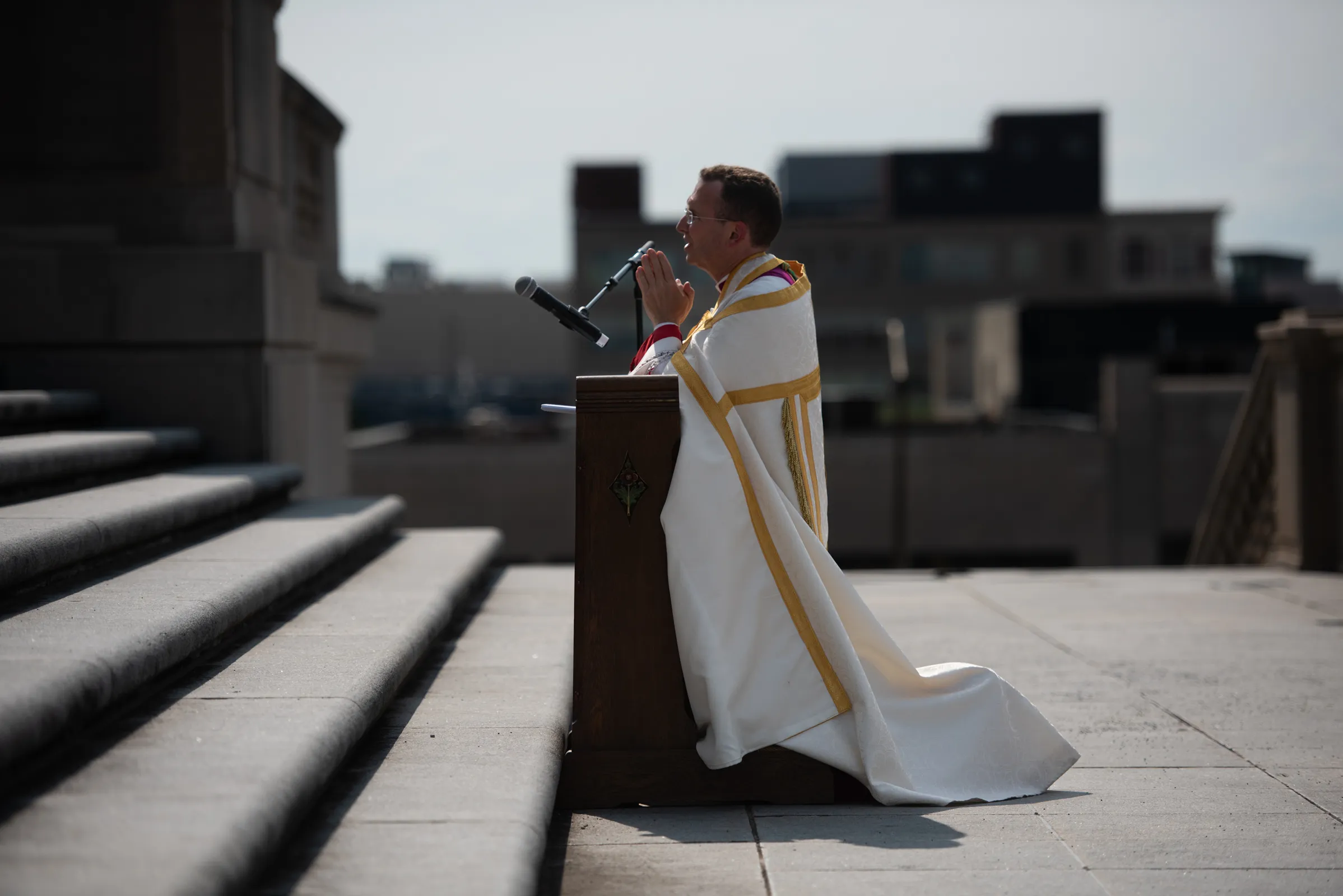 Bishop Andrew Cozzens prays before the Blessed Sacrament on the Indiana War Memorial. Credit: Jeffrey Bruno