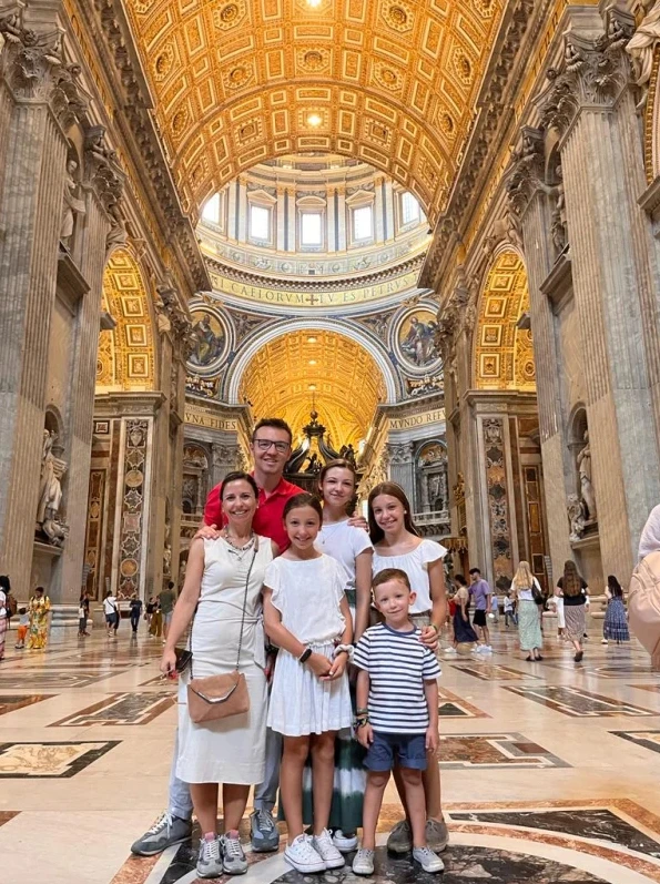 Lola, her husband, Pablo, and their four children visiting St. Peter's Basilica during their 2022 family vacation. Credit: Courtesy of Lola Rosique