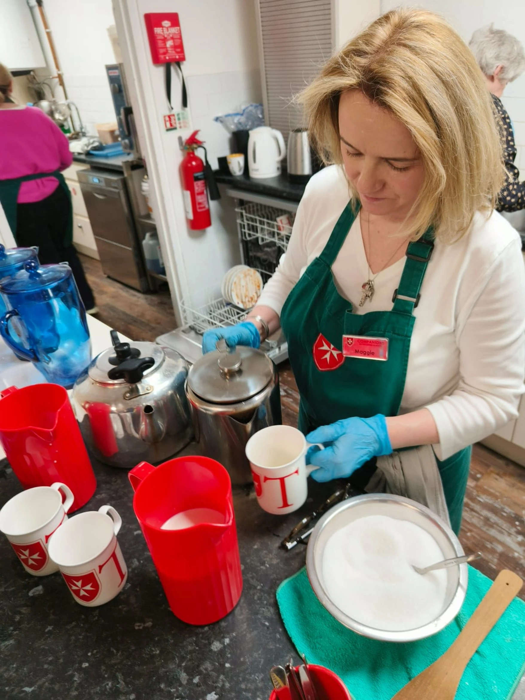 A volunteer helps at the Companions Café in London. Jan. 16, 2025. Credit: Photo courtesy of Westminster City Council