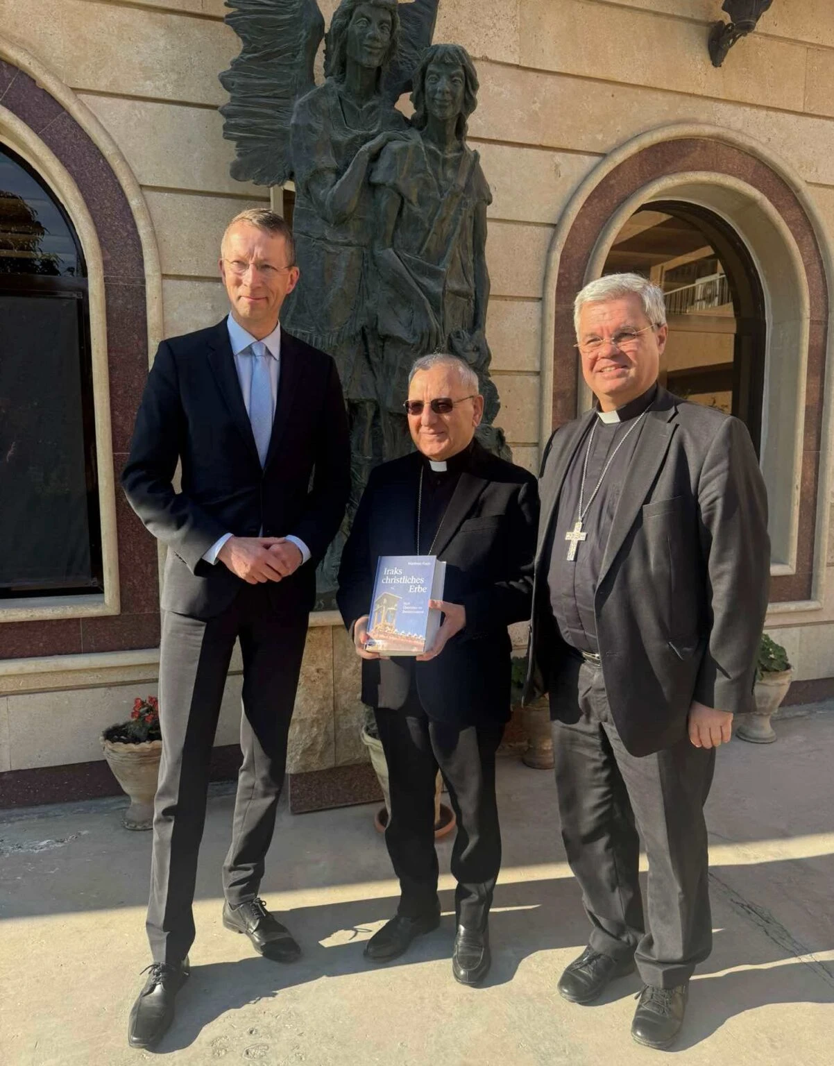 The German delegation, made up of German theologian and journalist Matthias Kopp and Archbishop Udo Markus Bentz of Paderborn, met with Chaldean Patriarch Louis Sako in Baghdad. Credit: Chaldean Patriarchate