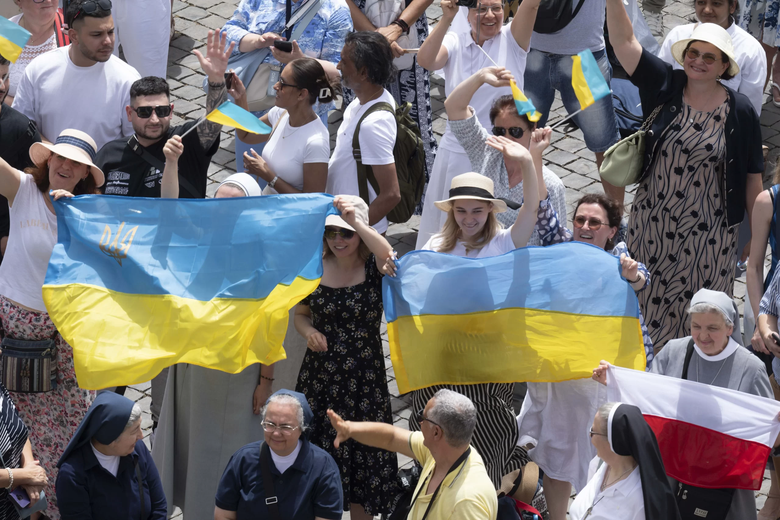 At his Angelus address June 9, Pope Francis  asked people to pray for the people who are suffering in Myanmar and in Ukraine, giving a special shoutout to some Ukrainians who were in the crowd waving flags. Credit: Vatican Media