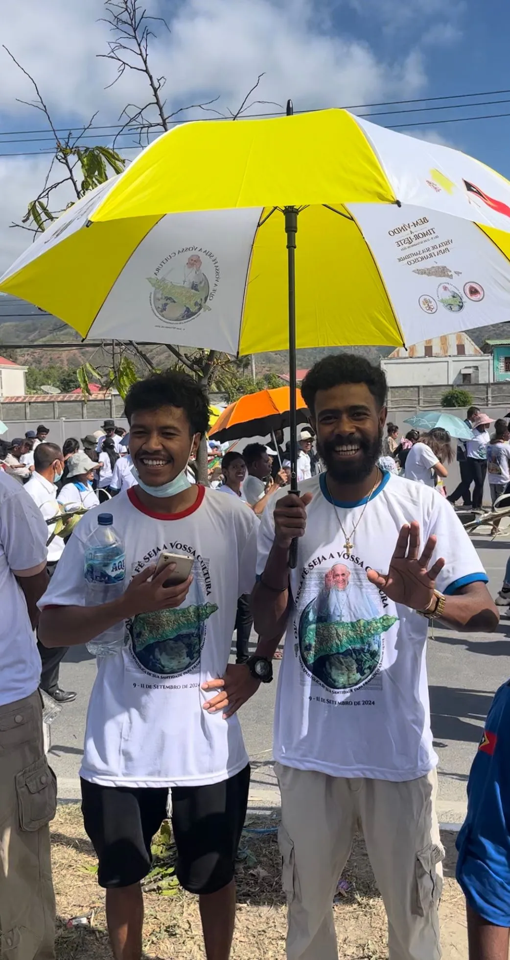 Huge crowds lined the streets of Dili, East Timor for miles for Pope Francis’ arrival on Sept. 9, 2024, waving Vatican flags and standing under special yellow-and-white Vatican-themed umbrellas for relief from the midday sun. Credit: Courtney Mares/CNA