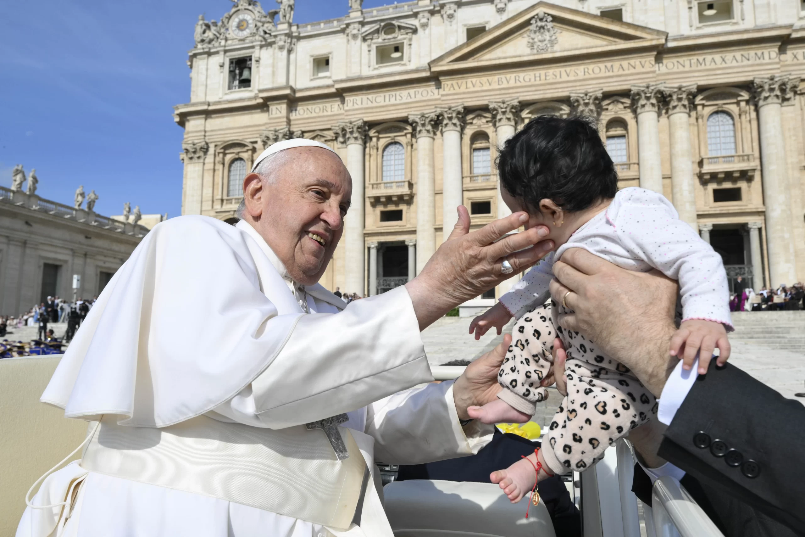 Pope Francis blesses a toddler during his general audience on Wednesday, May 29,  2024, in St. Peter’s Square at the Vatican. Credit: Vatican Media