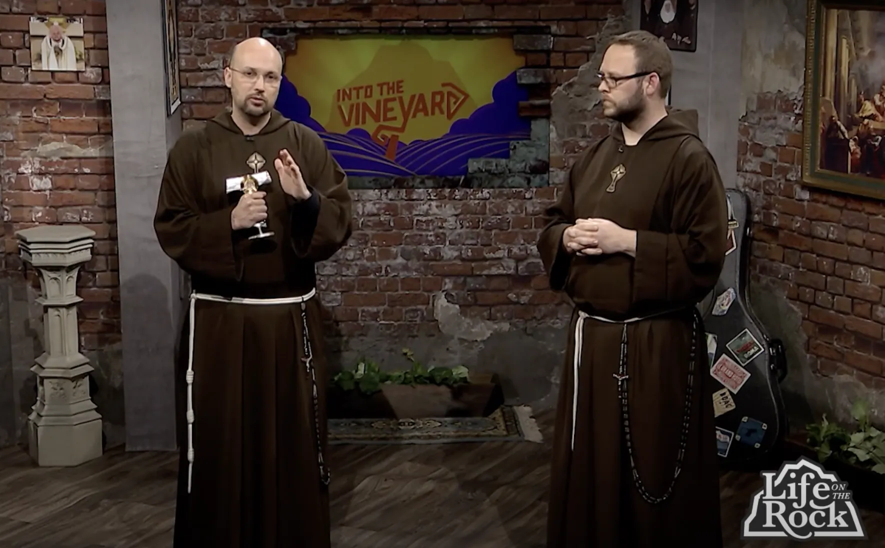 Father John Paul Mary performs a blessing with a relic of St. Maximilian Kolbe's beard on the set of "Life on the Rock." Credit: EWTN/Screenshot