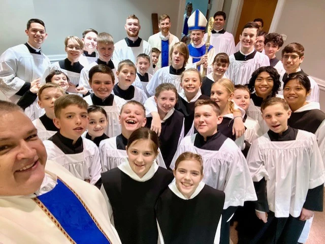 Father John Mosimann poses with altar servers and Bishop Michael Burbidge of Arlington, Virginia. Credit: Photo courtesy of Father John Mosimann