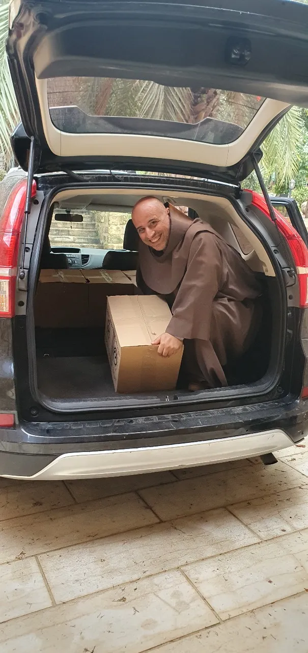 The Franciscan friar Father Toufic Bou Mehri, while bringing food parcels to the families of Deir Mimas, a little Lebanese village 4  kilometers from the Israeli border. The groceries are purchased with the support of the Apostolic Vicariate of Beirut and of the association Pro Terra Sancta, affiliated with the Custody of the Holy Land. Courtesy of Father Toufic Bou Mehri