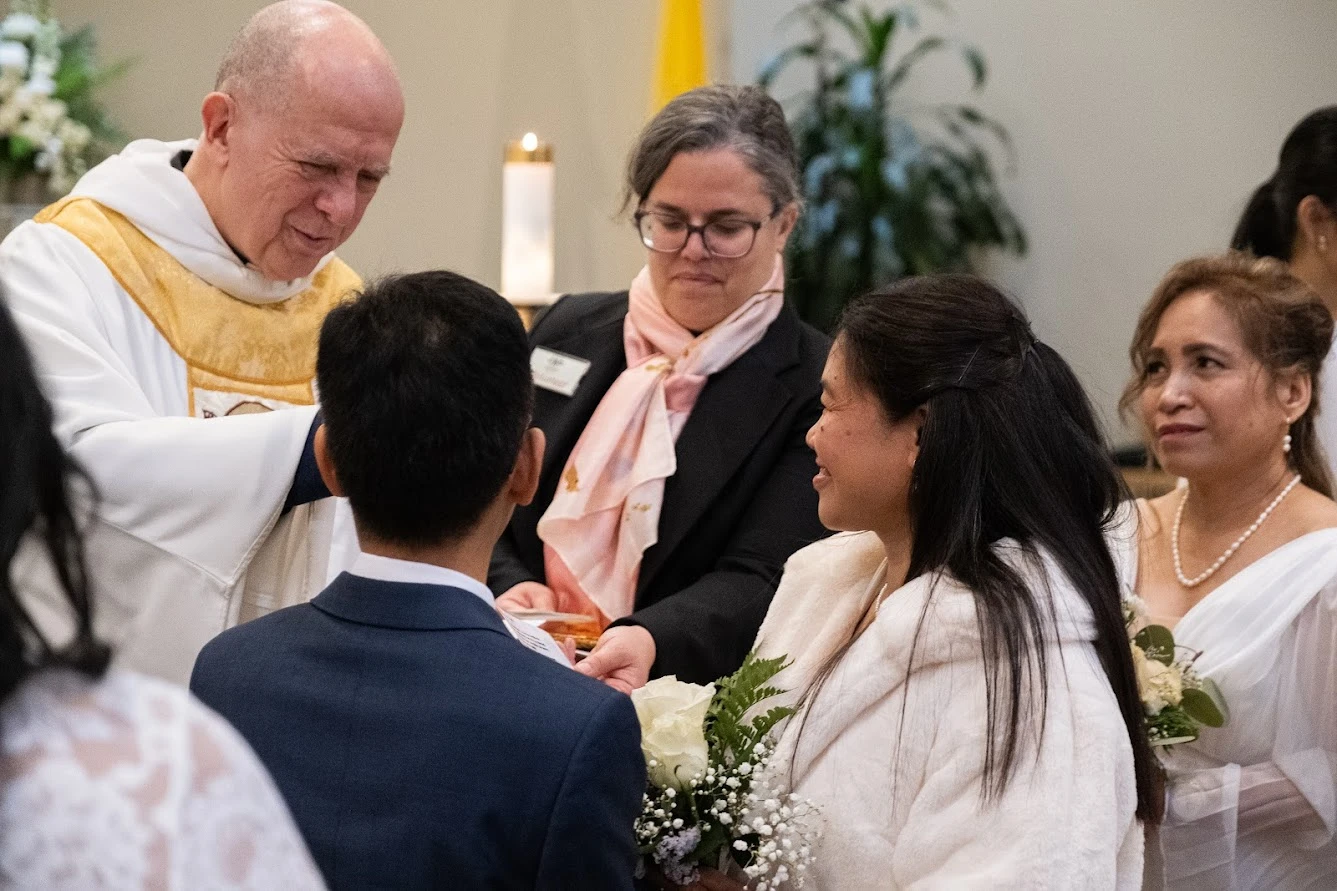 Father Gabriel De Chadarevian, OP, officiates the vows of Eddelyn and Mario John. Credit: Nicholas Elbers/The B.C. Catholic